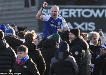 Macclesfield fans invaded the pitch after their side cause the FA Cup's biggest ever upset