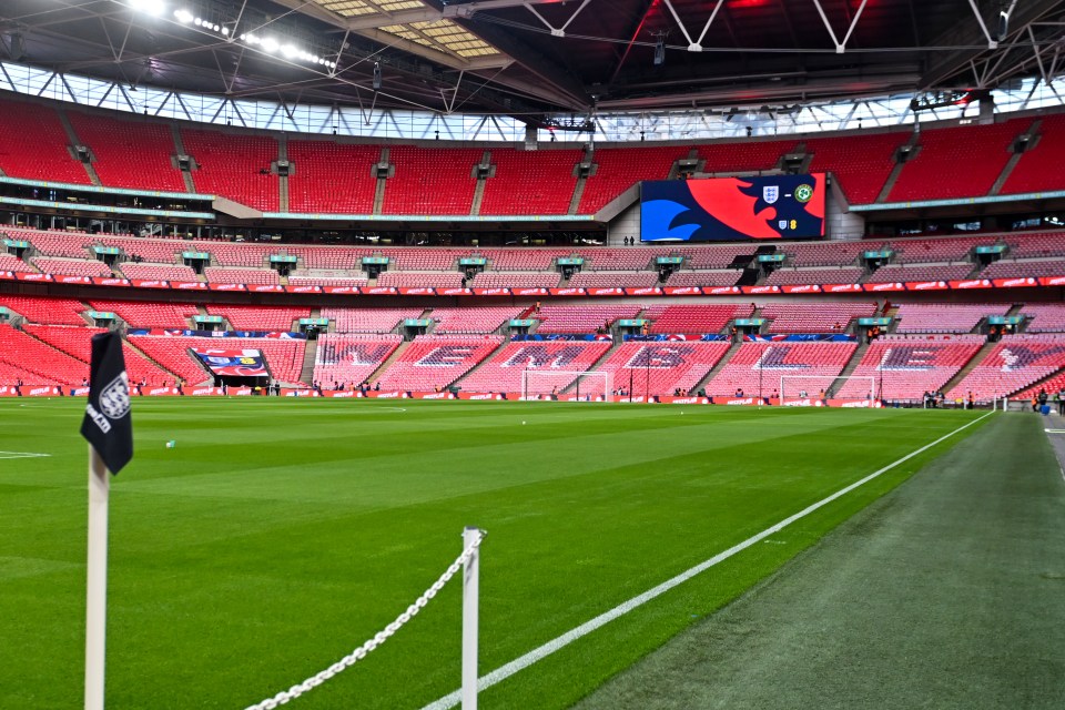 A general view of an empty Wembley Stadium with a scoreboard showing "England vs. Republic of Ireland".