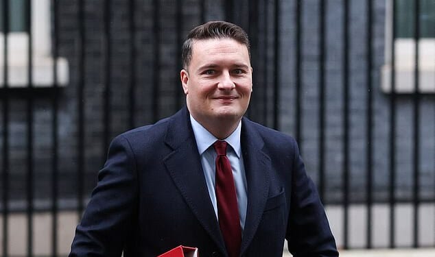 Wes Streeting is seen leaving Downing Street on Tuesday. Last night he hailed a potentially life-saving improvement in NHS ambulance response times