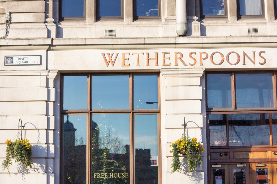 The front facade of a JD Wetherspoon pub in Trinity Square, London.