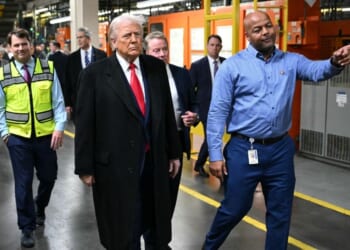 President Donald Trump, alongside Ford CEO Jim Farley, Treasury Secretary Scott Bessent, Ford executive chairman Bill Ford, and plant manager Corey Williams, tours Ford Motor Company's River Rouge complex in Dearborn, Michigan, on Jan. 13, 2026.