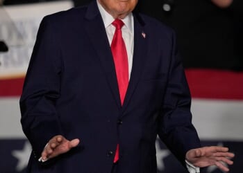 President Donald Trump arrives to speak about the economy at a rally Tuesday, in Clive, Iowa