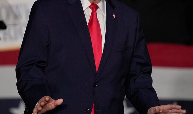 President Donald Trump arrives to speak about the economy at a rally Tuesday, in Clive, Iowa