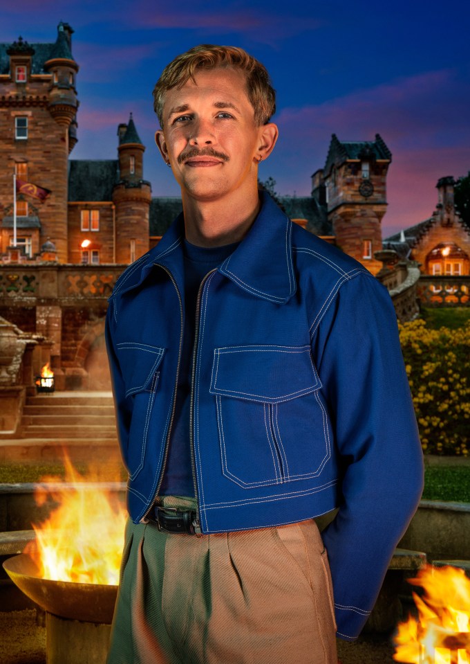Stephen, a 32-year-old Cyber Security Consultant from London, posing in front of a castle at dusk with a fire pit in the foreground.