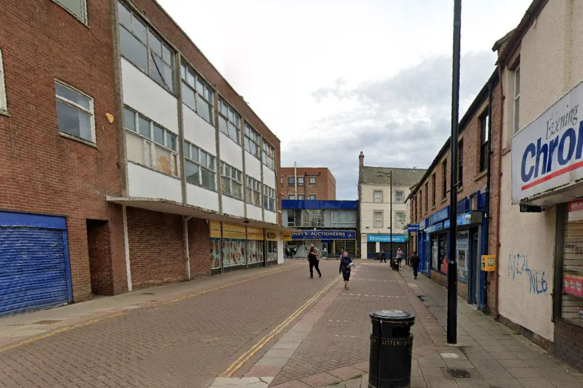 An image collage containing 1 images, Image 1 shows Street view of Russell Street in North Shields, with brick buildings and shops on both sides