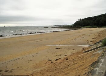 A woman in her 60s has died and two others have been taken to hospital after getting into difficulty in the water at Helen's Bay (pictured) in County Down, Northern Ireland