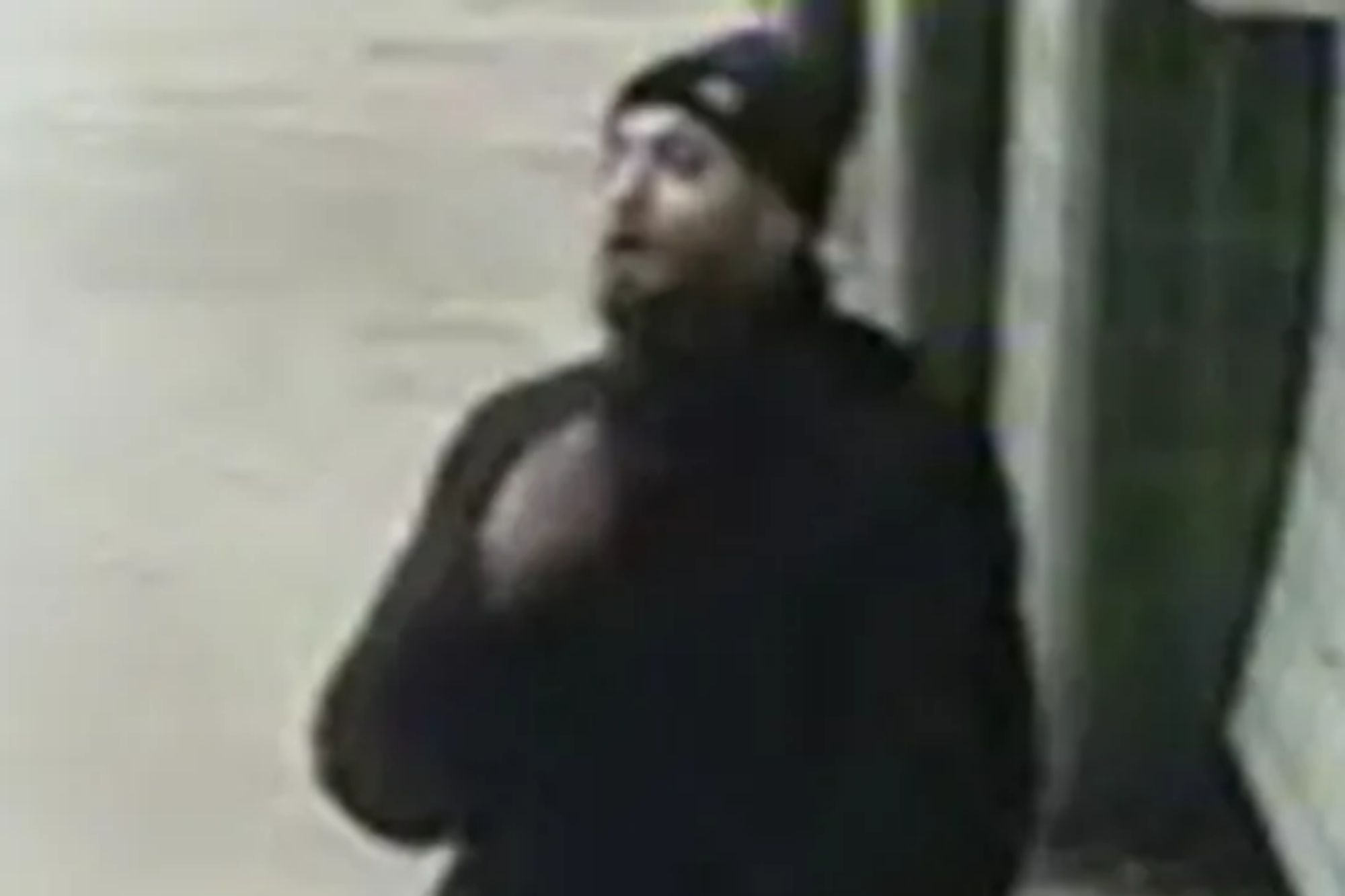 An image collage containing 1 images, Image 1 shows A man in a black beanie, black hoodie, and black pants walking