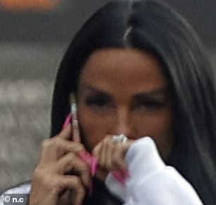 Katie tried, and failed, to flash a glimpse of her new wedding jewellery