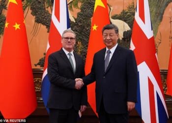 Britain's Prime Minister Keir Starmer shakes hands with Chinese President Xi Jinping ahead of a bilateral meeting during his visit to China
