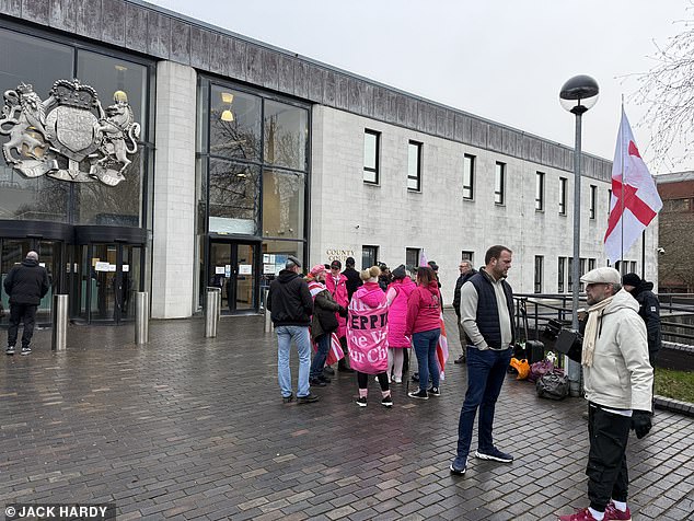 Ahead of today’s hearing, protesters including Tommy Robinson gathered outside Coventry Crown Court waving Union Jacks.