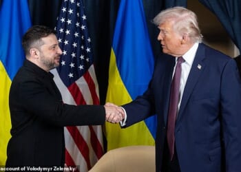 Volodymyr Zelensky and US President Donald Trump shaking hands during their bilateral meeting on the sidelines of the World Economic Forum (WEF) annual meeting in Davos on January 22, 2026