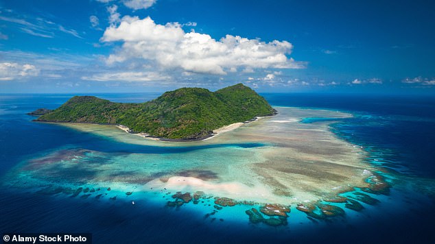 'Mayotte is France and that means Europe and the chance of a better life,' said one of the young migrants. Pictured: an aerial view of the islet M'Tsamboro, part of the island of Mayotte in the northernmost Mozambique Channel