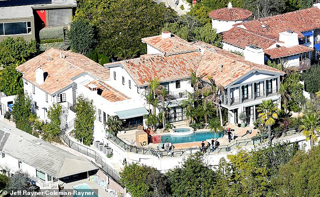 After: The property's traditional landscaping has been swapped for palm-lined greenery as the actor puts his personal stamp on the property