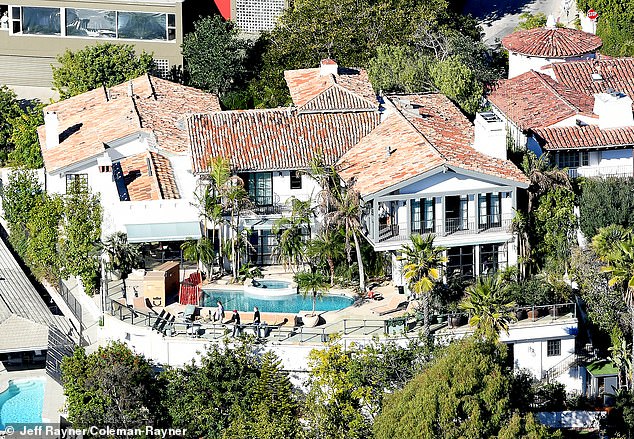 The palm trees not only add glamour but increase privacy at the six-bedroom estate nestled in the Hollywood Hills