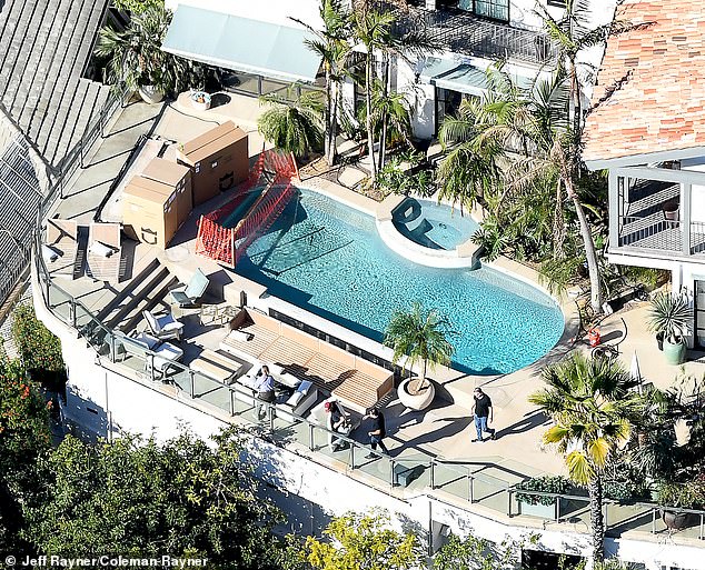 Rows of towering palm trees now surround the pool at Pitt’s LA home, giving the backyard the feel of a luxury vacation hideaway