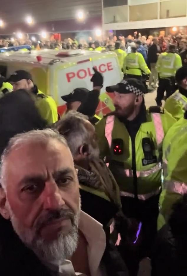 Mr Butt supported calls for protests against Israeli football club Maccabi Tel Aviv when they played Aston Villa in Birmingham last November. He is pictured here protesting