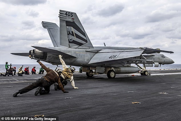 An F/A-18E Super Hornet attached to Strike Fighter Squadron (VFA) 151 launches from the flight deck of the Nimitz-class aircraft carrier USS Abraham Lincoln (CVN-72) as it conducts routine flight operations in the Arabian Sea on January 28, 2026
