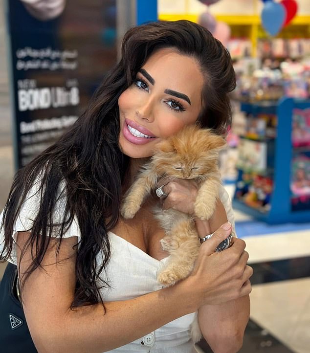 Before Lee popped the question to Katie, making him her ninth fiancé, he was reported to have been married for several years to Palestinian-born and Qatari raised health and fitness coach Dina, 41, (pictured) whom he met in the gym in Dubai at the start of 2020