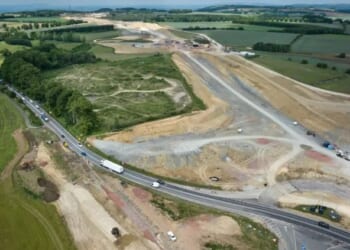 Man in his 40s killed and woman & 2 children injured after crash with car transporter as A-road closed for several hours