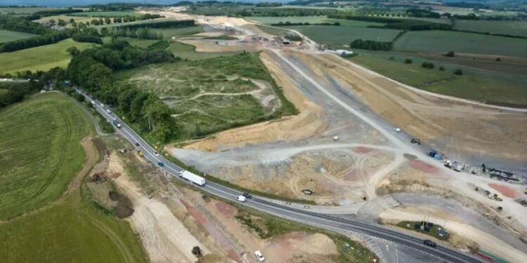 Man in his 40s killed and woman & 2 children injured after crash with car transporter as A-road closed for several hours