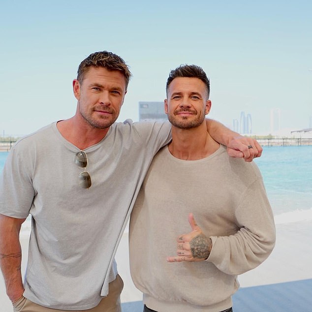 ... but has she finally found her Prince Charming in the form of handsome, heavily tattooed and massively muscled stuntman Bobby Holland Hanton (here pictured with Chris Hemsworth)?