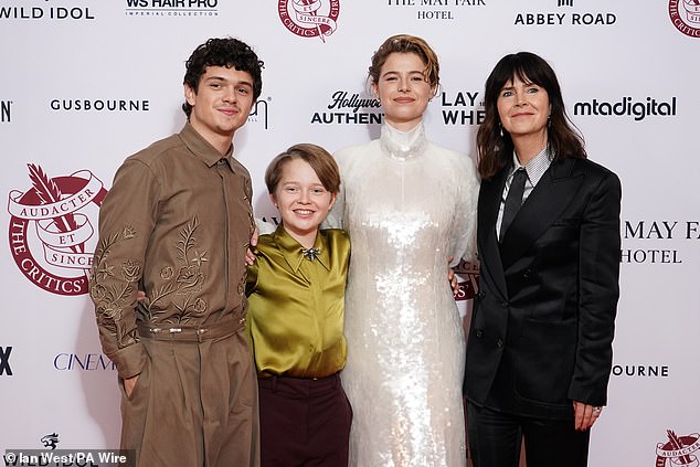 The Hamnet cast also posed with their producer Liza Marshall who looked stylish in a suit