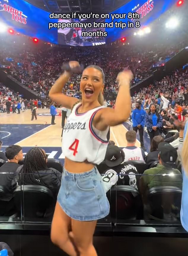 The influencer doesn¿t shy away from flaunting her jet-setting lifestyle online ¿ at a basketball game in the US