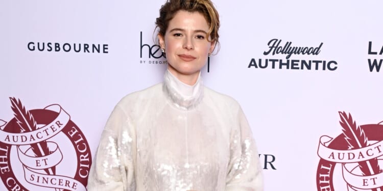 Jessie Buckley stuns in white gown as she scoops another Best Actress award for her role in Hamnet