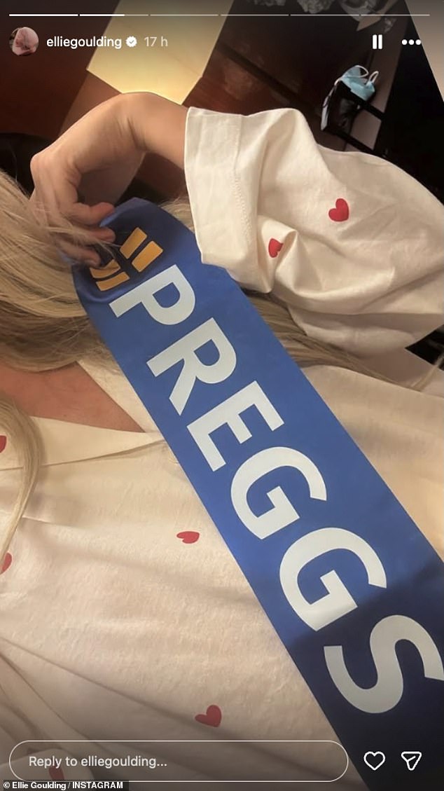 Ellie looked stunning in a pink Versace mini dress which hugged her blossoming bump along with a sash, in a nod to high street baker Greggswhich read: 'Preggs'