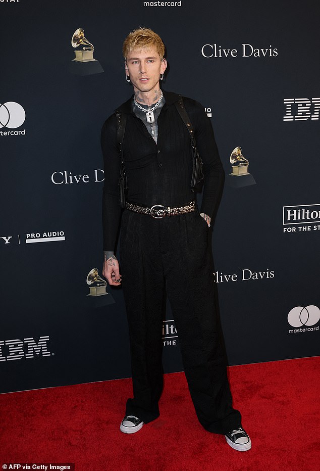 Machine Gun Kelly showcased his signature edgy style as he rocked the red carpet in an elevated, monochromatic outfit