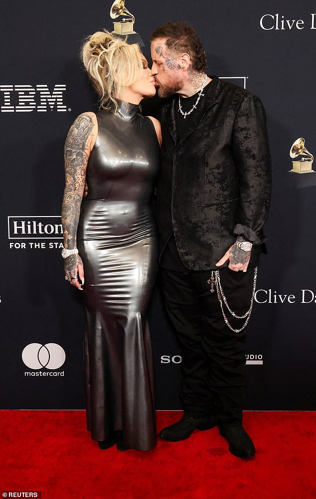 The couple put on a loved-up display on the red carpet as they shared a kiss in front of the cameras