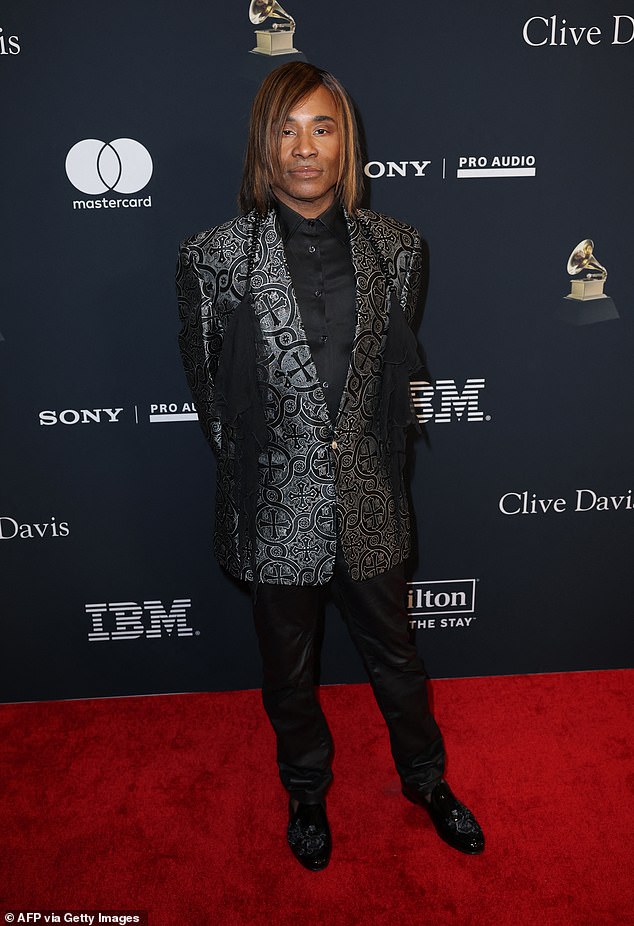 Billy Porter dressed to impress, as per usual, in a patterned blazer paired with a chic, beaded scarf accessory. The Broadway star looked effortlessly stylish with intricate details to elevate his formal blazer and dress pants combo