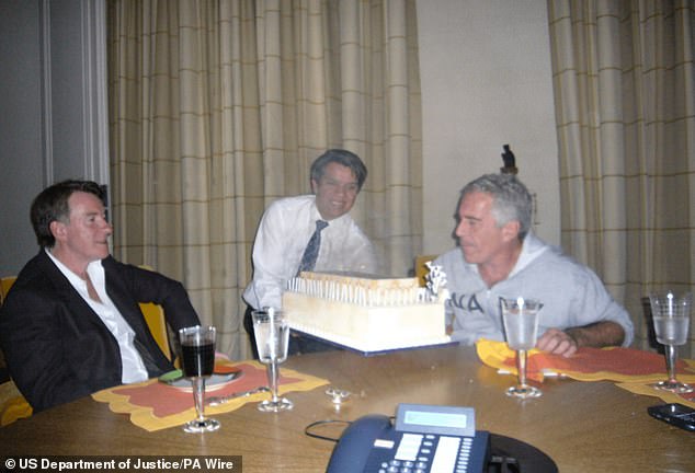 Lord Mandelson (left) is pictured with Jeffrey Epstein (right) and a birthday cake in an image released in December