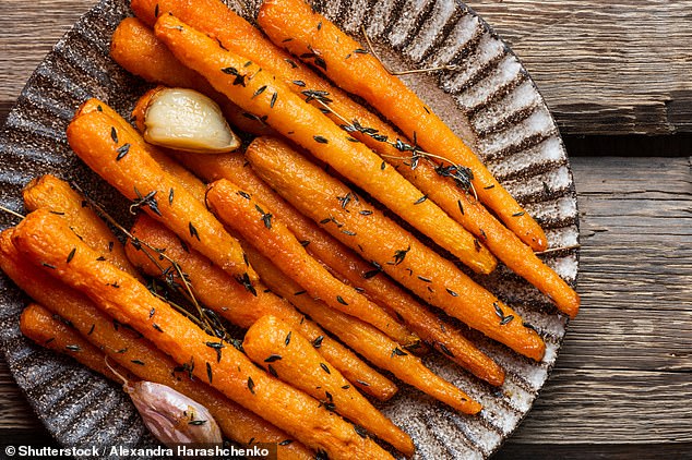 Vitamins A, D, E, and K are fat-soluble, which means adding a healthy fat like olive oil to your roast veg can boost your nutrient uptake (stock image)