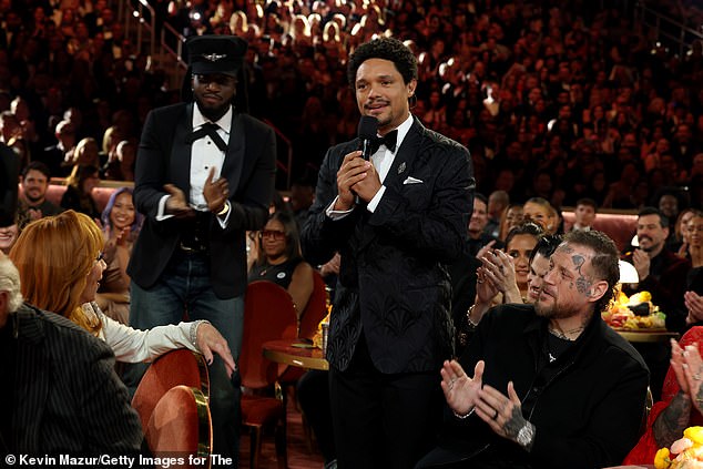 The president trashed the 'virtually unwatchable' ceremony before taking aim at the former Daily Show host (pictured) after he said that Trump 'wants Greenland' because 'with Epstein's island gone, he needs a new one to hang out with Bill Clinton'