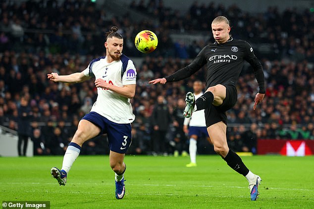 Radu Dragusin (left) had a tough afternoon on his first start in more than a year as Erling Haaland (right) targeted him
