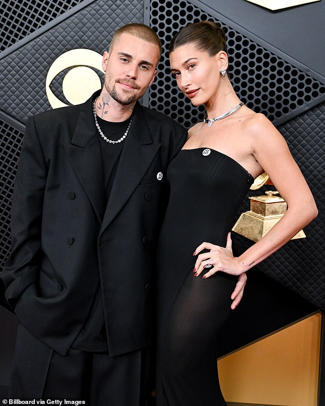 Just hours earlier, the couple had earlier walked the red carpet together wearing matching 'ICE OUT' pins while wowing in complementary black ensembles
