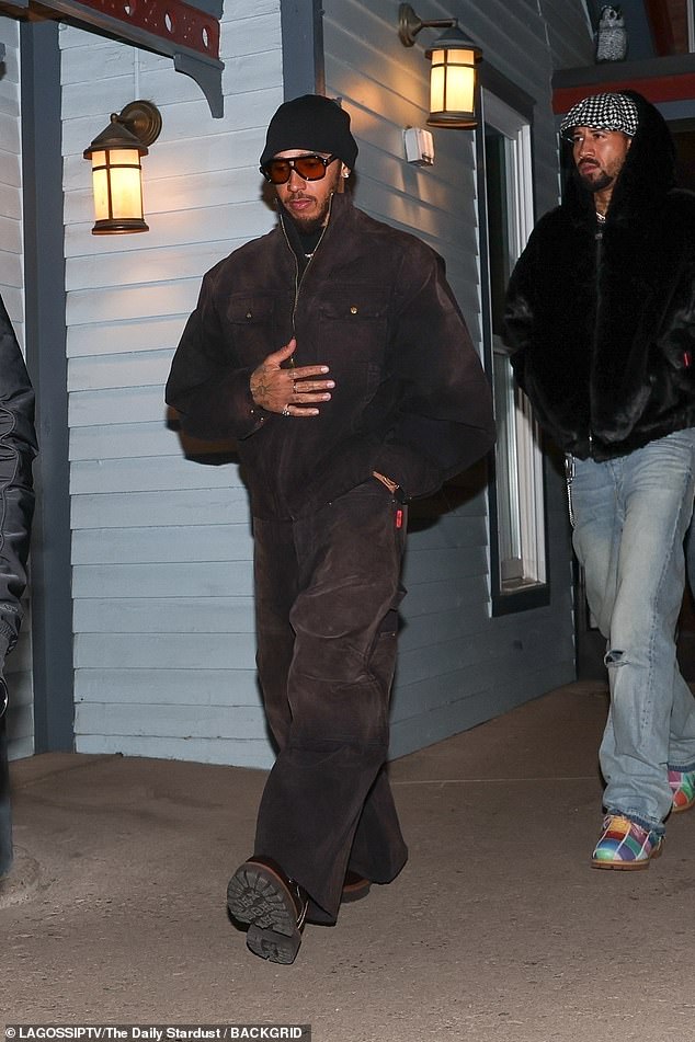 The reported new couple were pictured at the same party after both being invited to Kate Hudson's star-studded bash in the celebrity ski resort (pictured Lewis Hamilton)