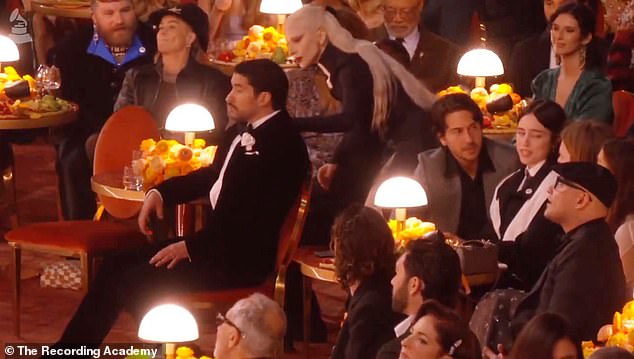 A clip that has been viewed nearly two million times on X showed Bad Bunny sitting in his seat during the ceremony when Gaga, 39, approached him from behind and tapped his shoulder