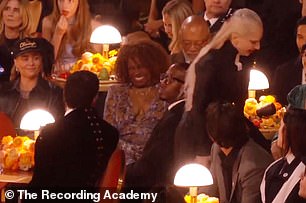 After his shocked reaction to her embrace, Gaga quickly left, as Bad Bunny appeared to look longingly after her