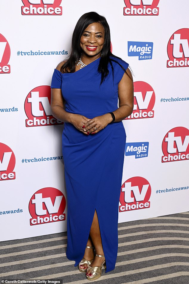 Denise Nurse dazzled in her blue dress that featured a slit at the legs