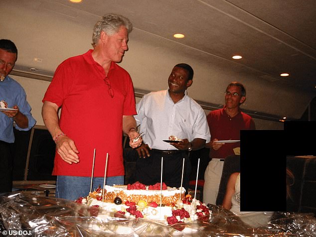 Bill Clinton is pictured lining up to eat cake