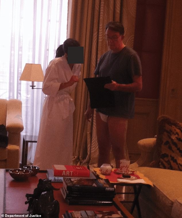 The photograph, which has been released as part of the Epstein files, apparently shows Lord Mandelson talking to a woman who is wearing a white bath robe