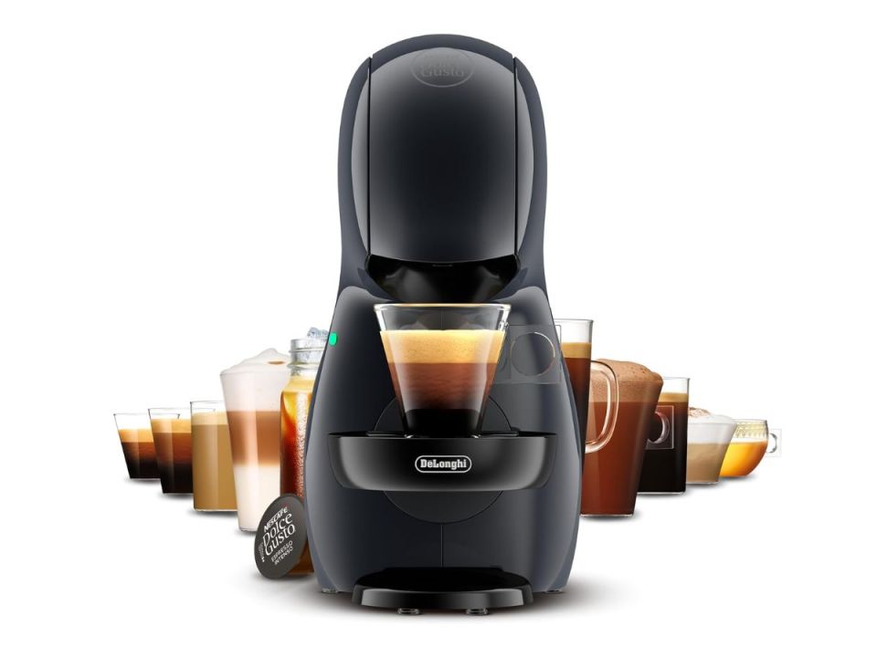 A black coffee machine with a single-serve cup of coffee being brewed, surrounded by various other coffee beverages.