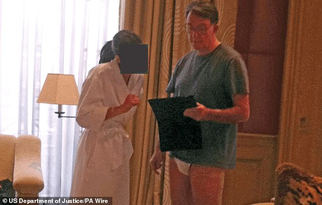 EDITORS NOTE: The Press Association has been unable to contact the copyright holder of this photograph. Subscribers are advised that they may be approached by the individual or organisation concerned for payment.BEST QUALITY AVAILABLE Handout document issued by the US Department of Justice which appears to show Lord Mandelson in his underwear speaking to an unknown person wearing a bathrobe. The image appears in the documents known as the "Epstein Files" released by the Department of Justice.  Issue date: Monday February 02, 2026. PA Photo. Photo credit should read: US Department of Justice/PA Wire NOTE TO EDITORS: This handout photo may only be used for editorial reporting purposes for the contemporaneous illustration of events, things or the people in the image or facts mentioned in the caption. Reuse of the picture may require further permission from the copyright holder.