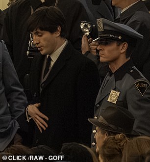 Mescal is surrounded by police officers while filming scenes as Paul McCartney