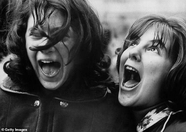 Pictured: Hysterical fans lose their minds as The Beatles arrive at the Plaza Hotel in 1964