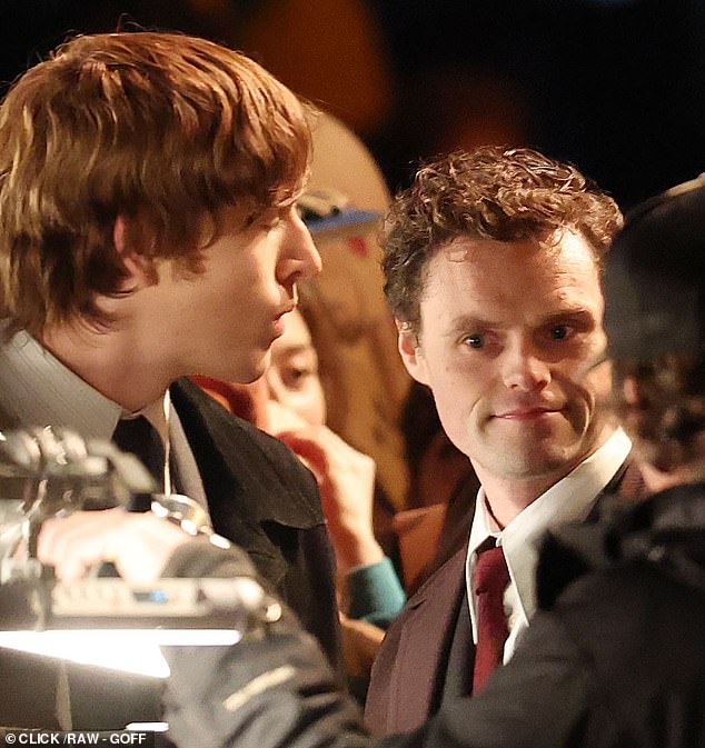 John Lennon, played by Dickinson, is surrounded by fans after arriving at the Plaza Hotel