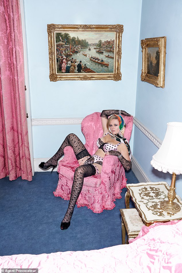 She posed with her legs akimbo in a racy look with a demure scarf wrapped around her head and a eye-popping lingerie set