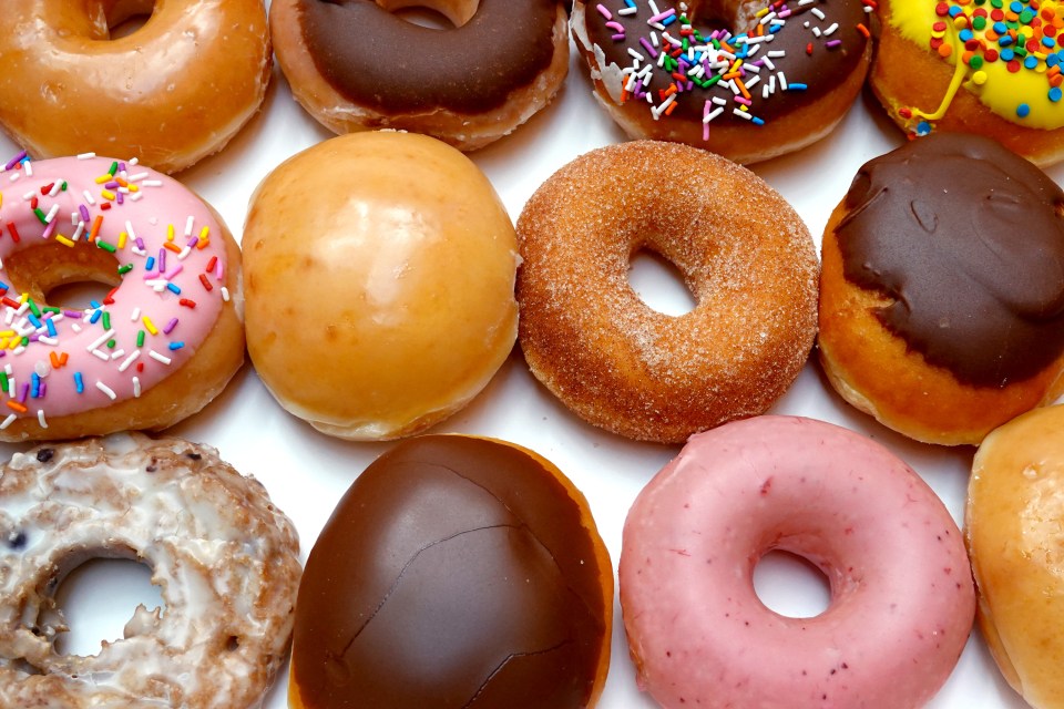A close-up of a variety of Krispy Kreme doughnuts.